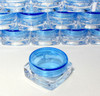 Mini square cosmetic jars with blue lids