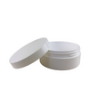 A sleek, white, wide mouth plastic jar with a thick wall construction with lid sitting next to the jar.