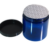 A blue 8 oz cosmetic jar with a seal on top of the jar and a black cap next to it